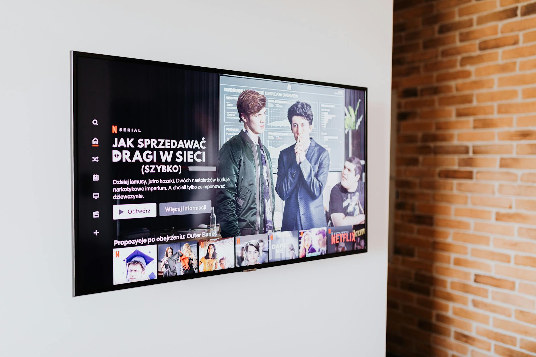 Person watching television shows on streaming platform with remote control