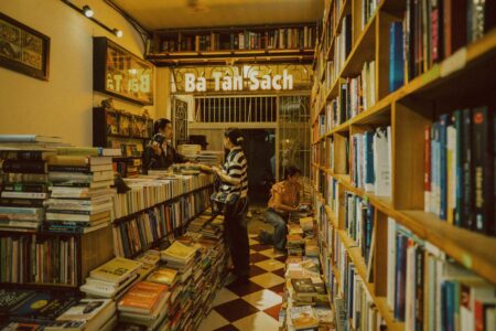 Local Bookstores Boost Revenue Through Author Event Streaming Services Cozy independent bookstore interior with shelves of books and reading area