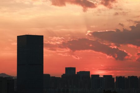 Urban skyline at sunset representing municipal infrastructure and development