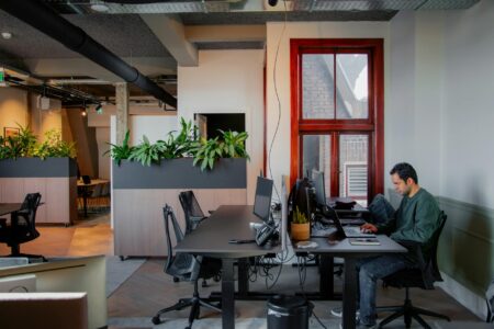 Modern office wellness area with exercise equipment and natural lighting