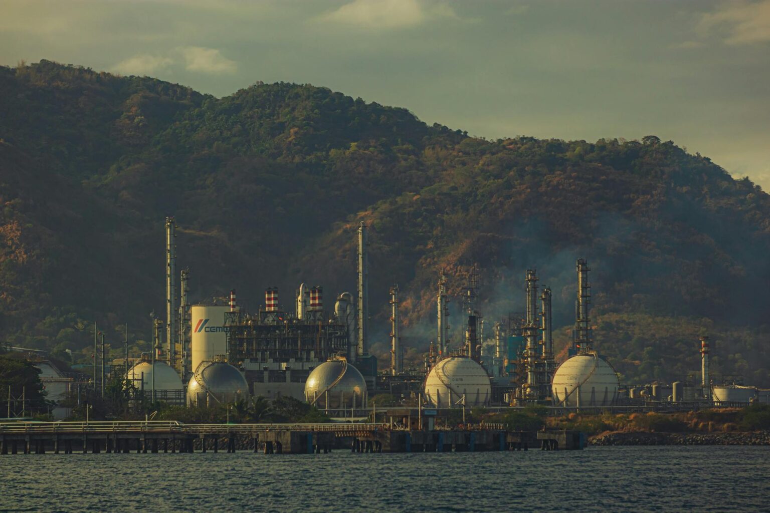 Modern water treatment facility with large industrial pipes and processing equipment