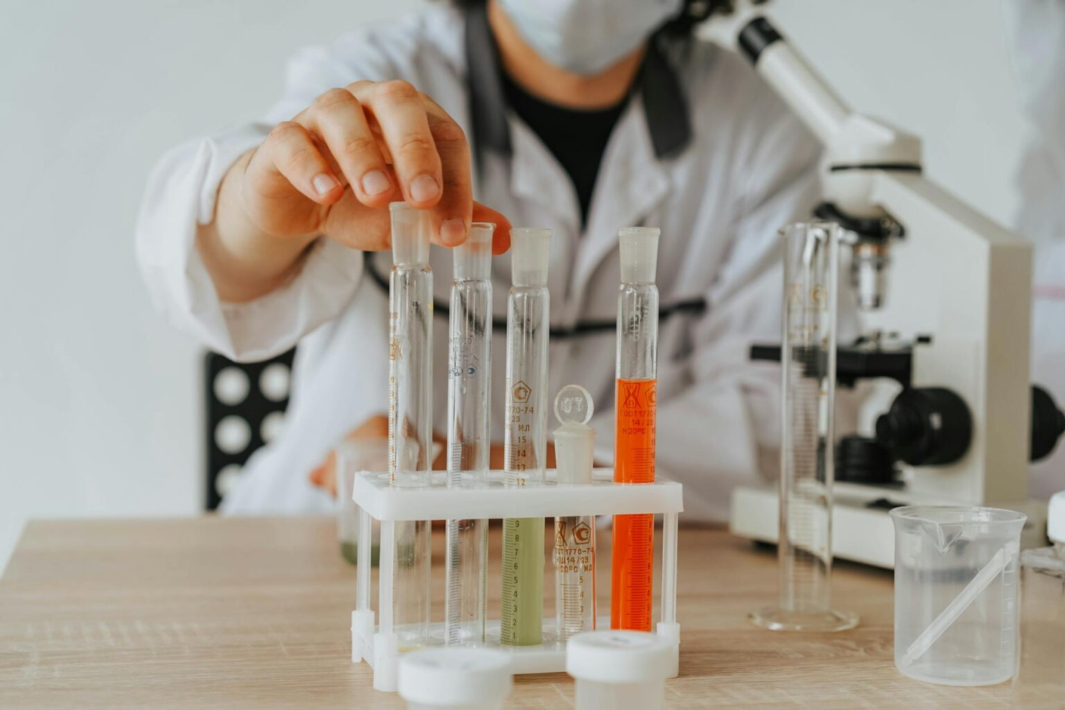 Scientists working in pharmaceutical research laboratory with equipment and samples