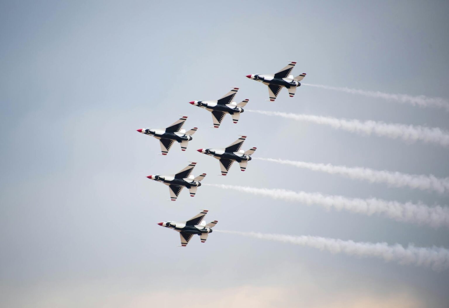 Modern military fighter jets on runway representing defense industry growth