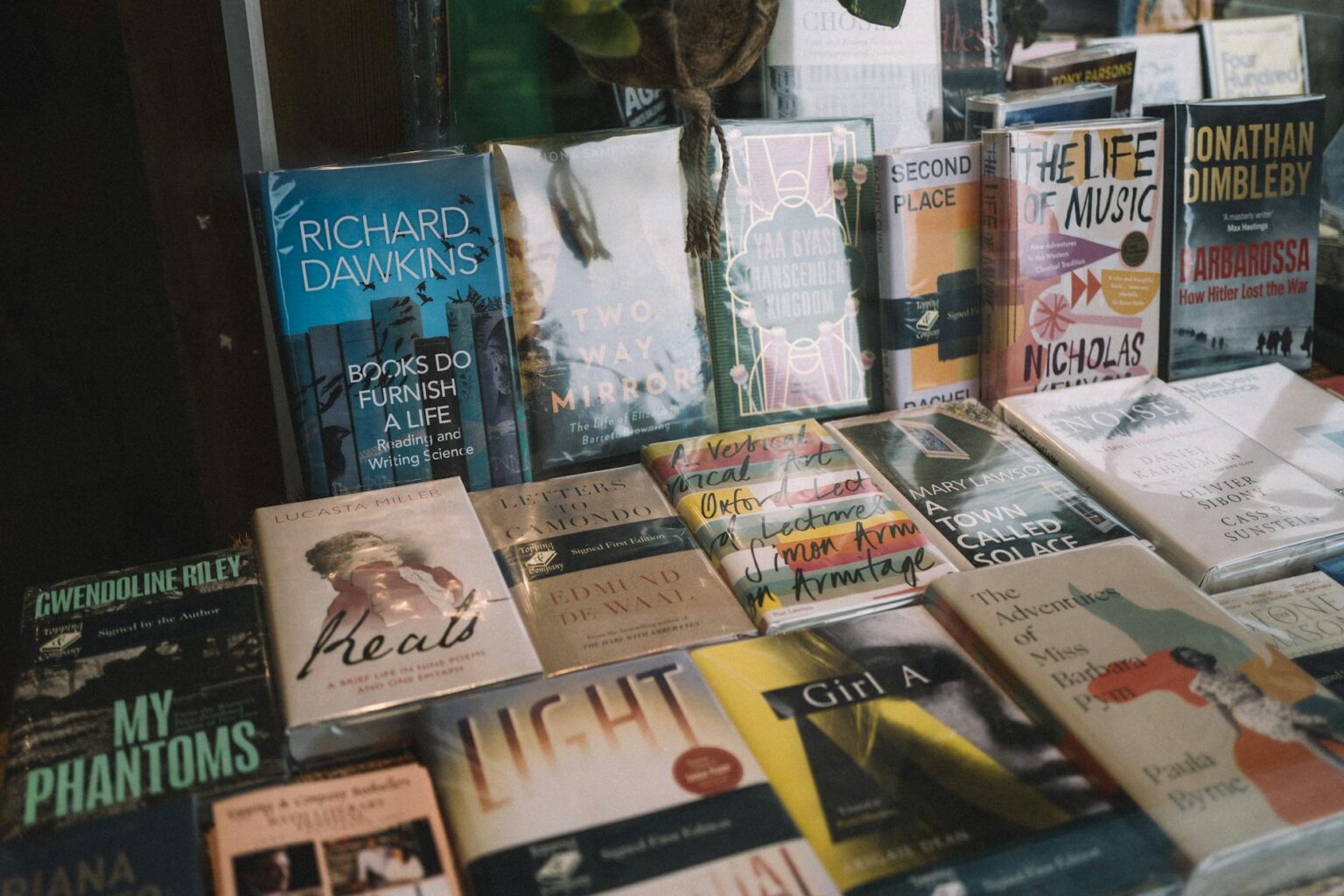 Cozy independent bookstore interior with reading chairs and book displays