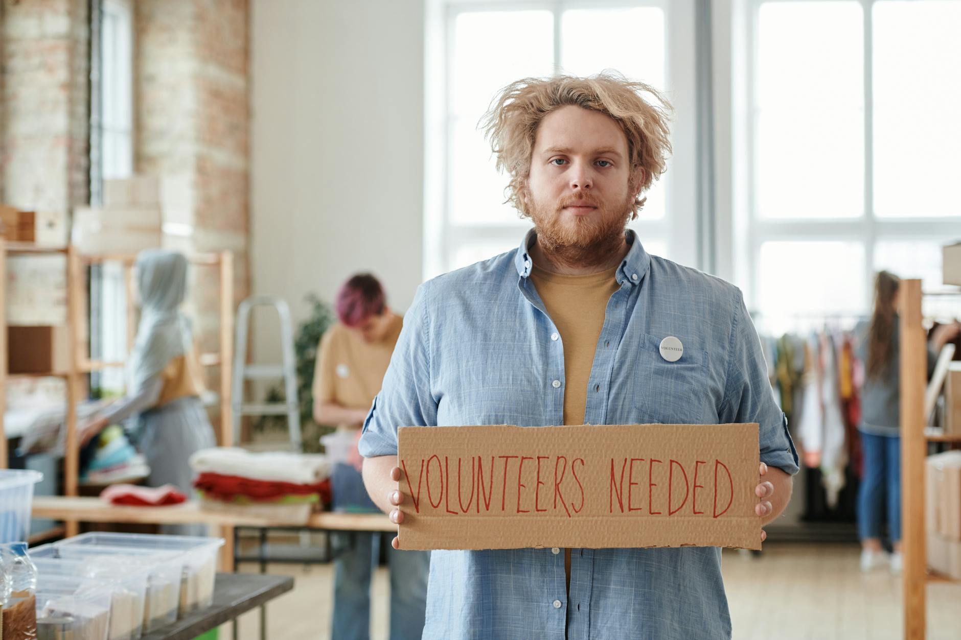Corporate employees participating in volunteer activities in modern office setting