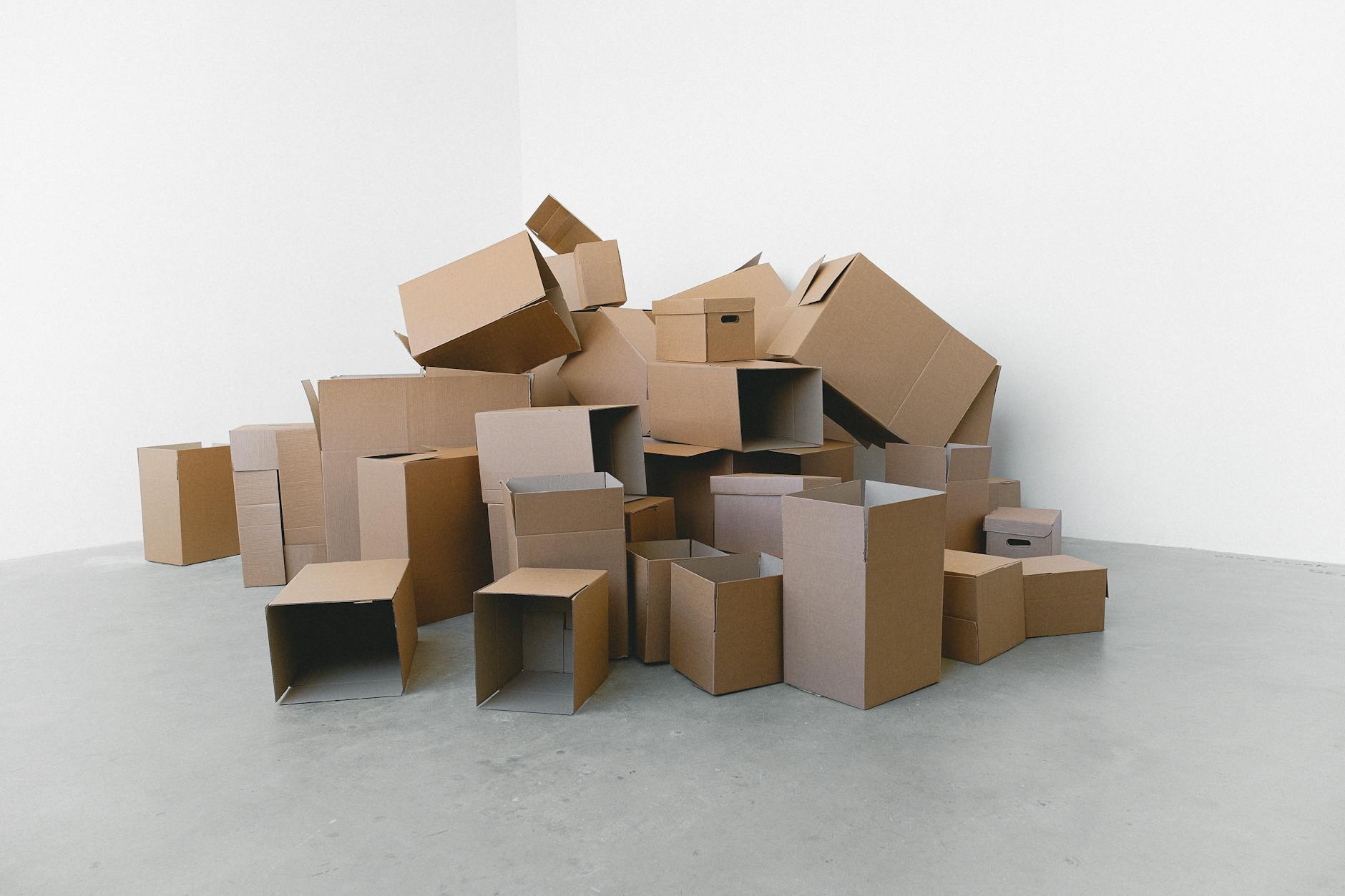 Stack of cardboard shipping boxes representing subscription box deliveries