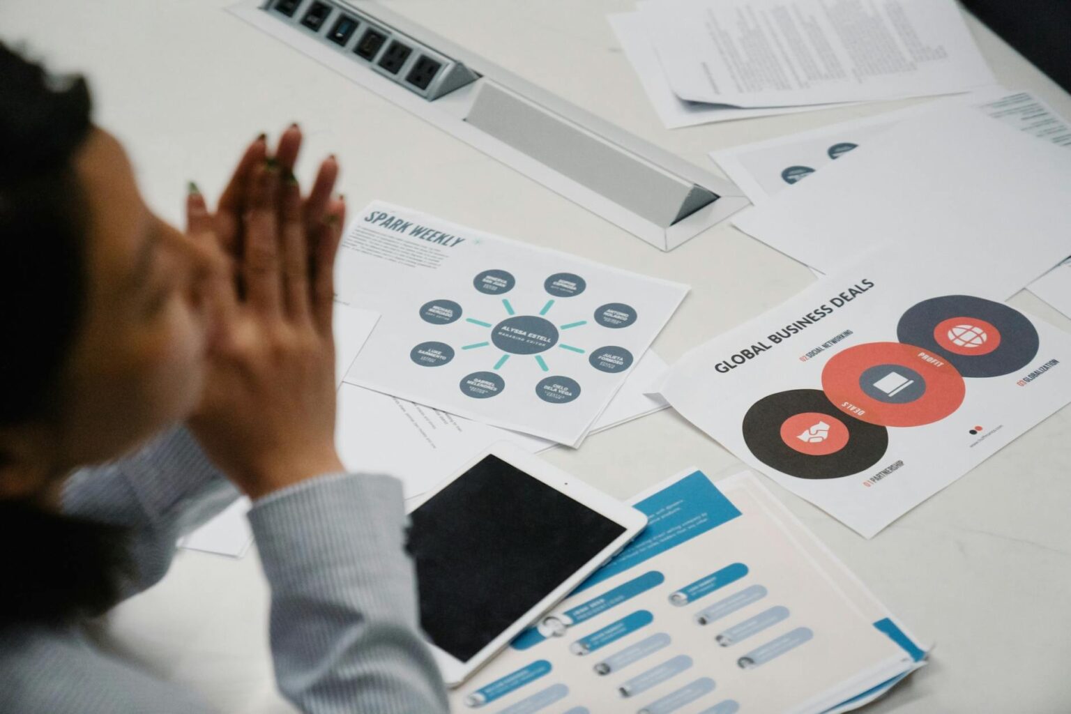 Professional meeting with insurance documents and financial paperwork on conference table