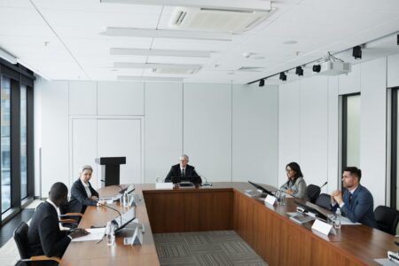 Business professionals collaborating in a modern conference room during a corporate development session