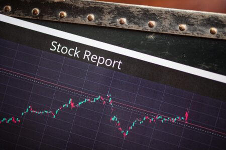 Financial charts showing stock market performance and dividend yield trends