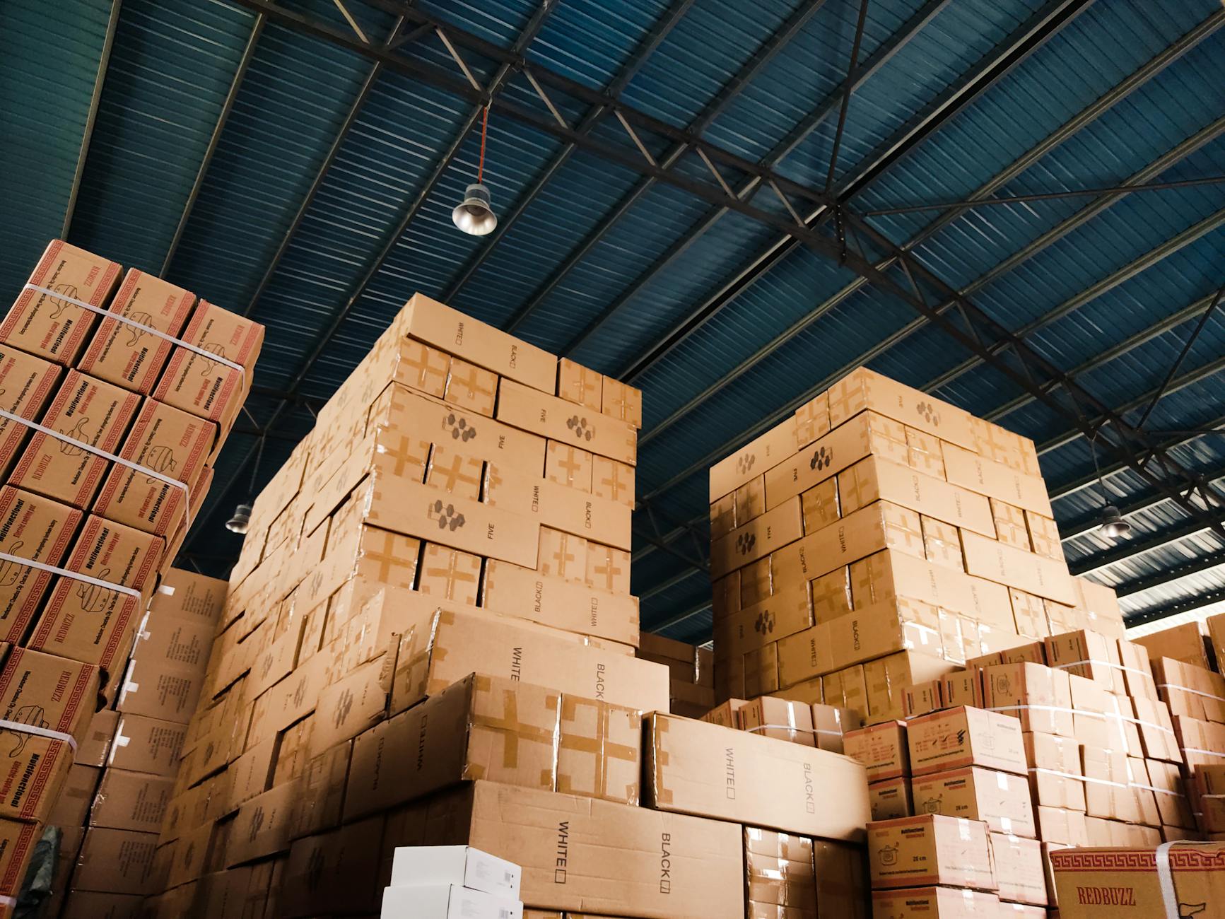 Large modern warehouse interior with high ceilings and storage systems