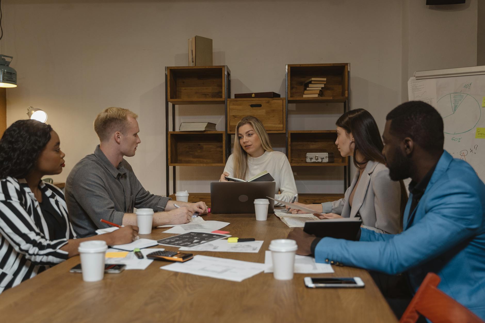 Financial advisor meeting with high-earning professional in modern office setting