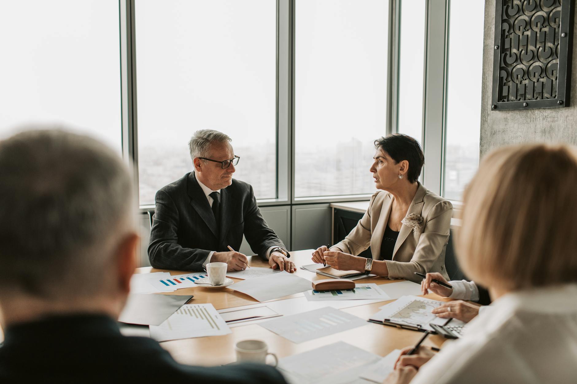 Professional business meeting discussing financial planning strategies