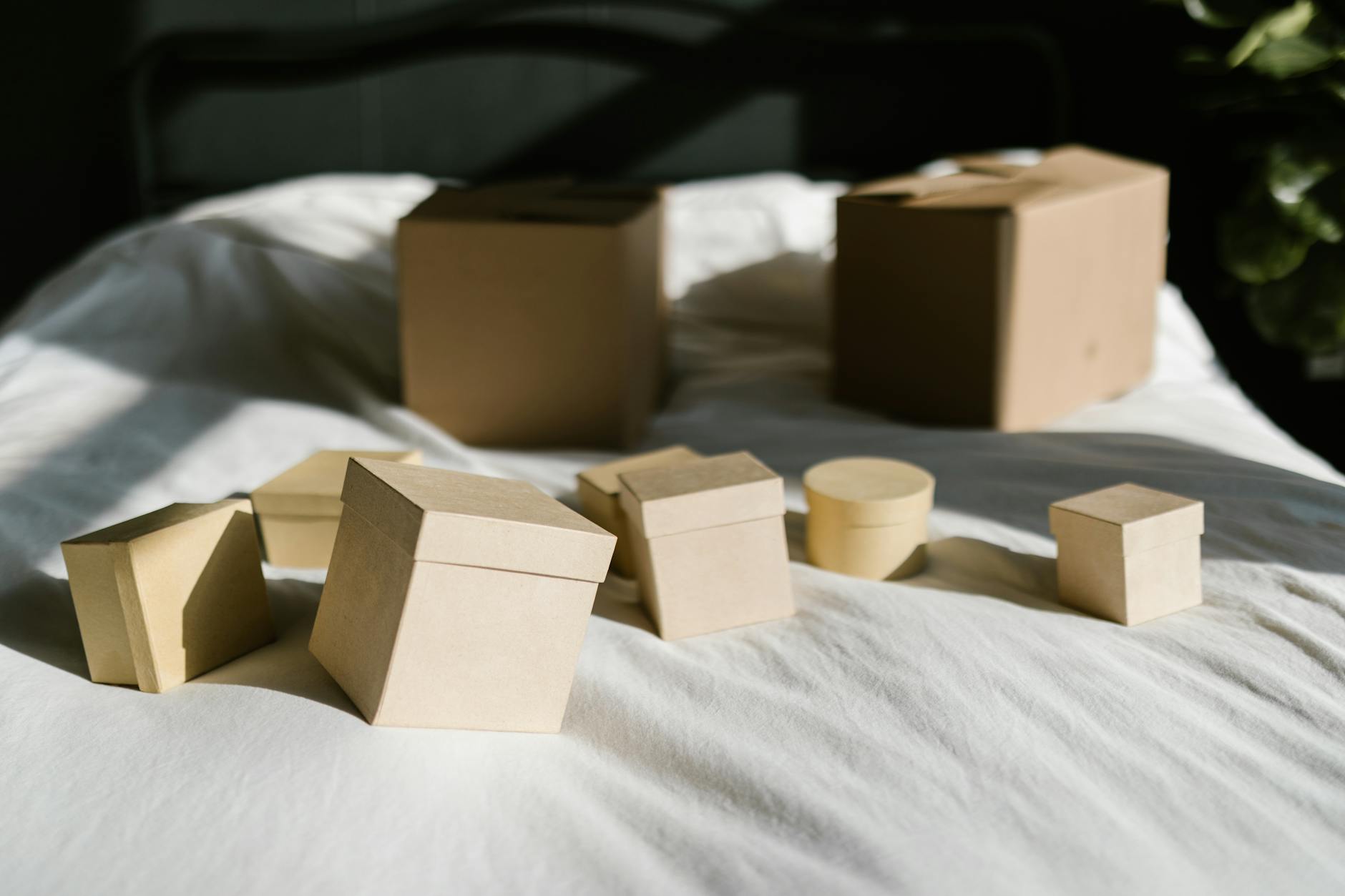 Cardboard shipping boxes arranged on wooden surface ready for delivery