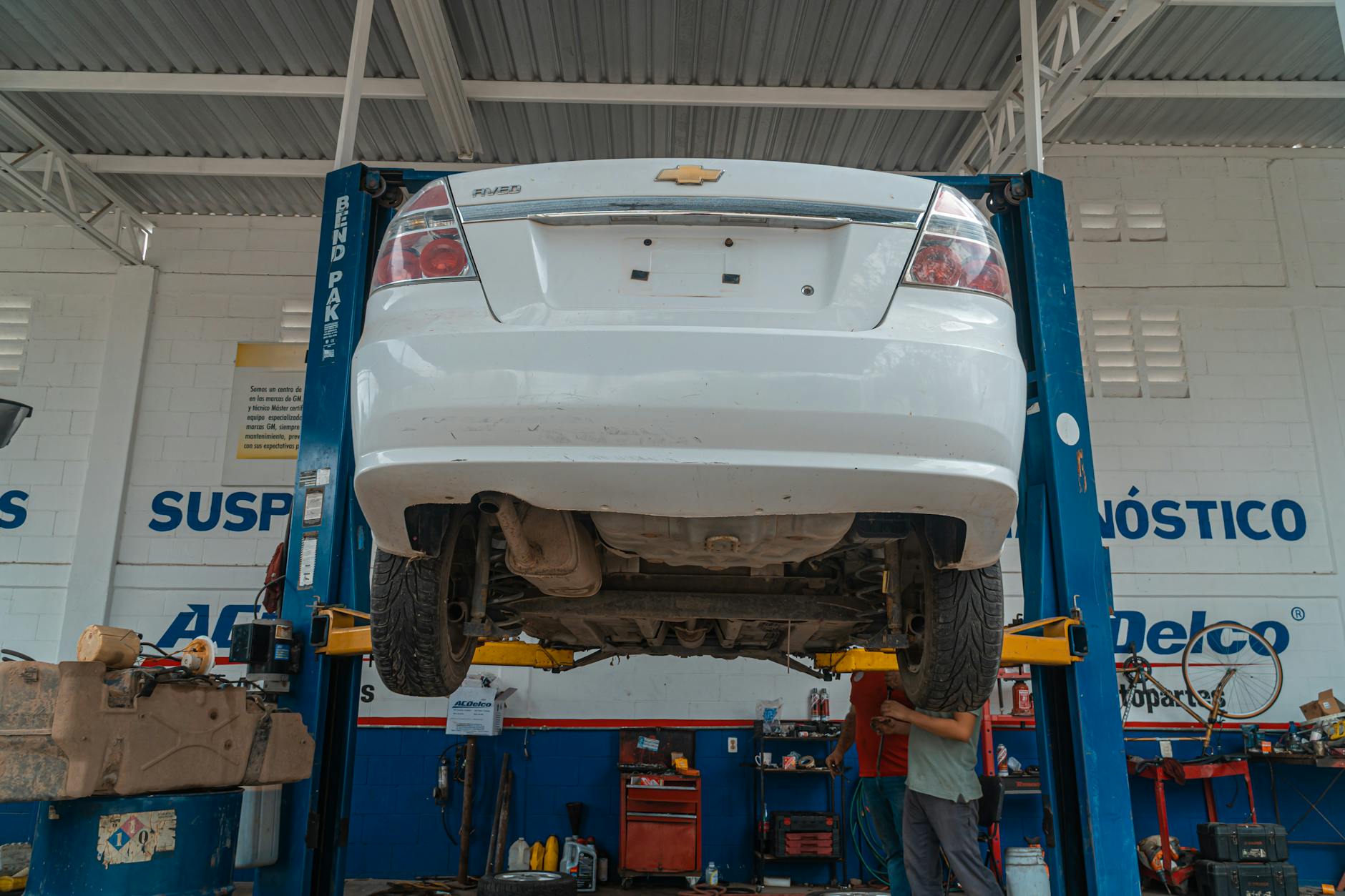 Interior of modern automotive service center with repair bays and equipment
