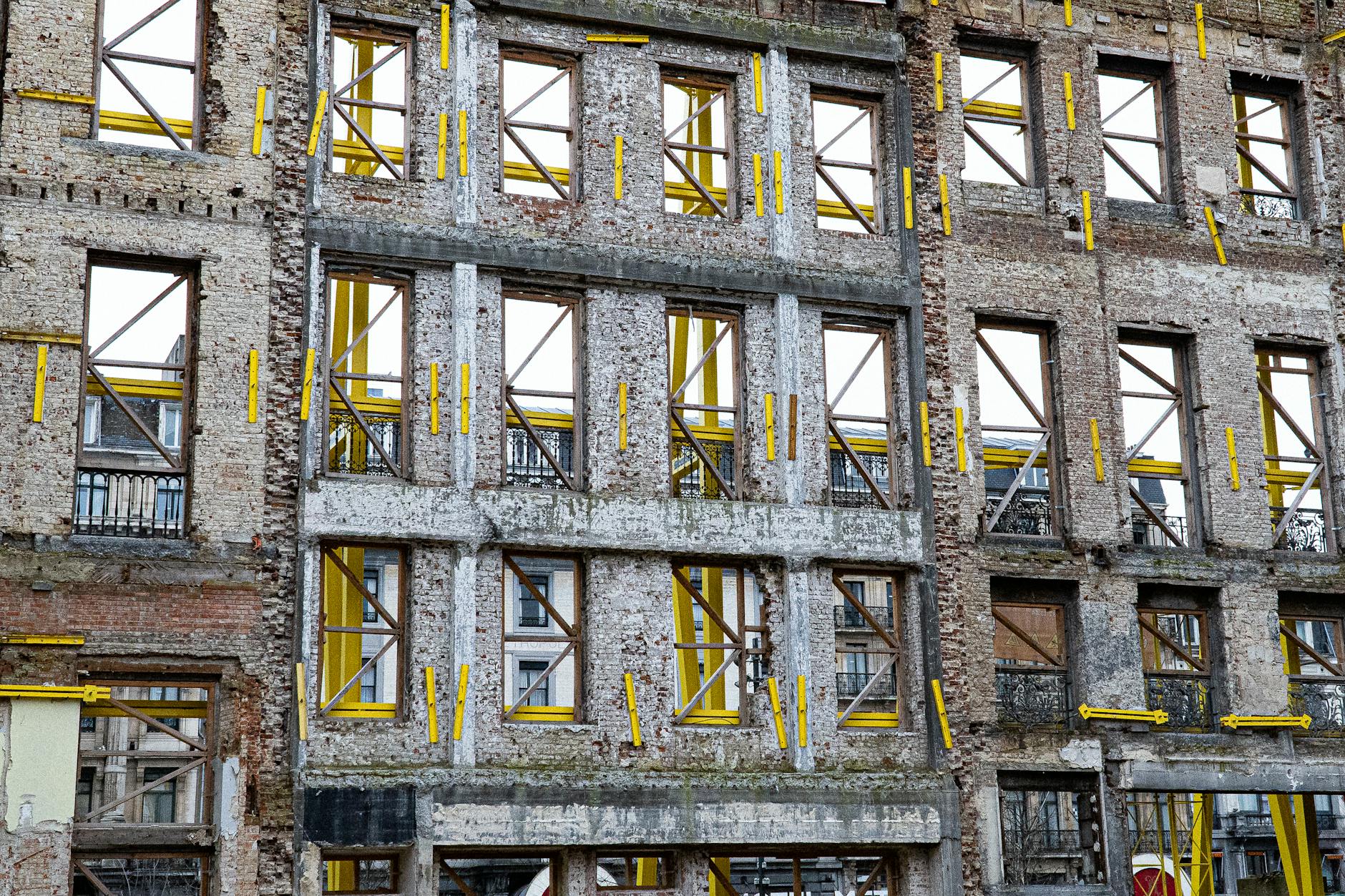 Construction workers renovating a commercial building for adaptive reuse conversion project