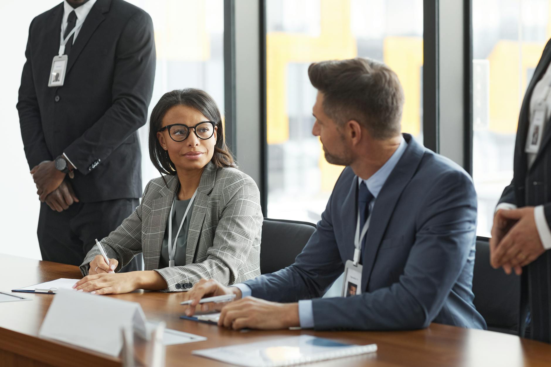 Corporate executives reviewing wellness program data and health metrics in conference room