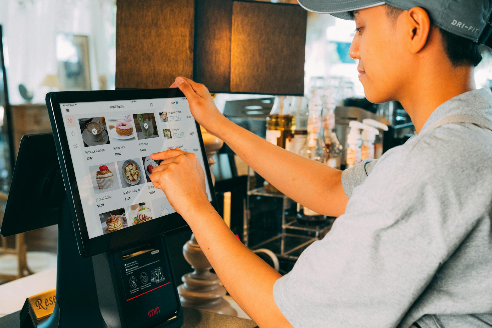 Digital menu display showing food prices at modern fast casual restaurant