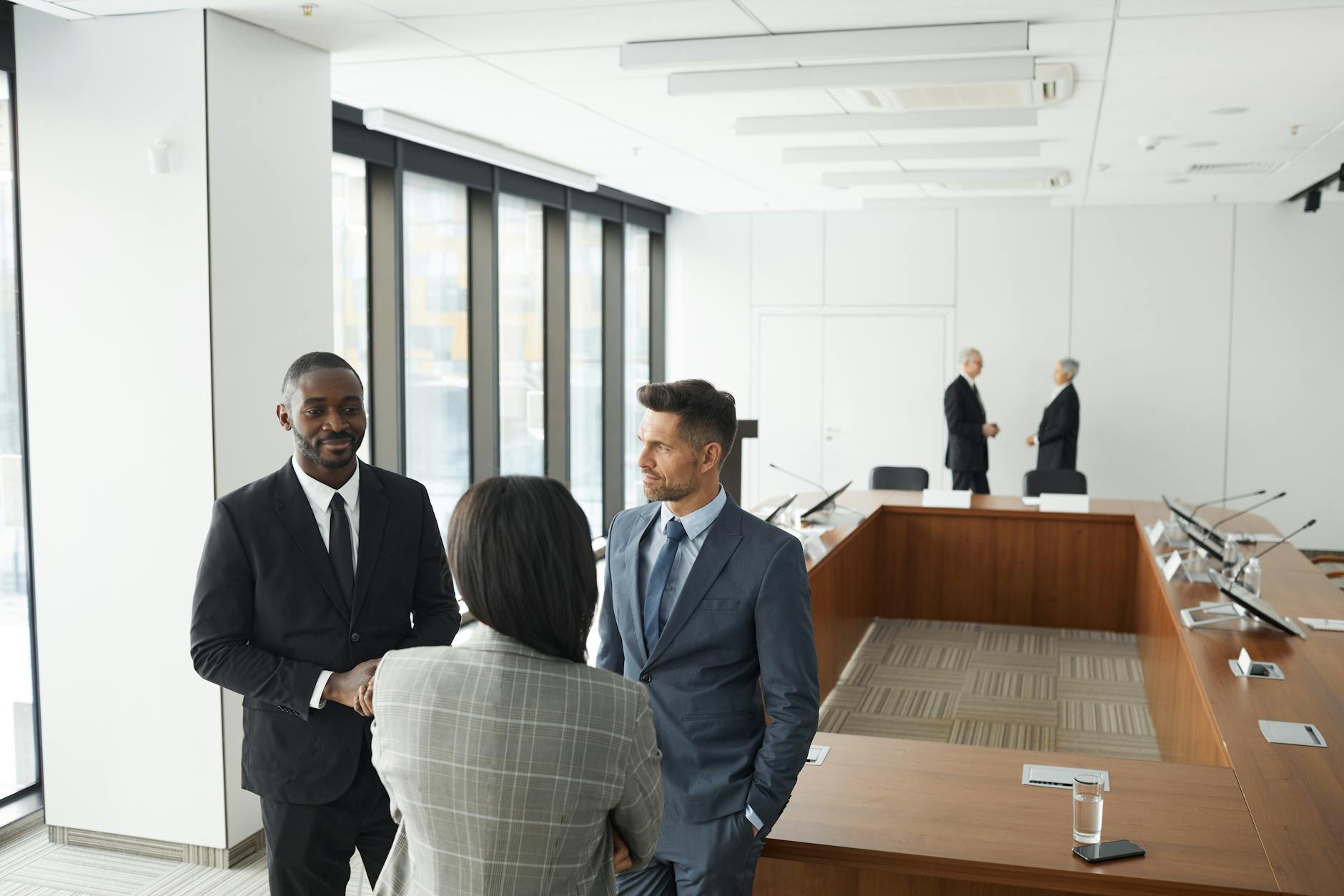 Financial advisor meeting with clients to discuss retirement planning strategies