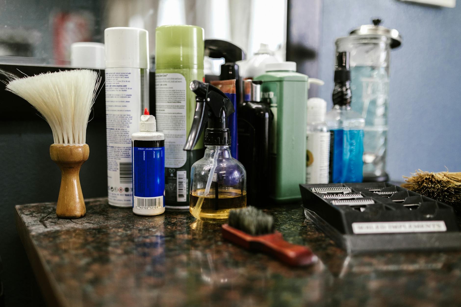 Premium men's grooming products including pomades and beard oils on wooden shelf