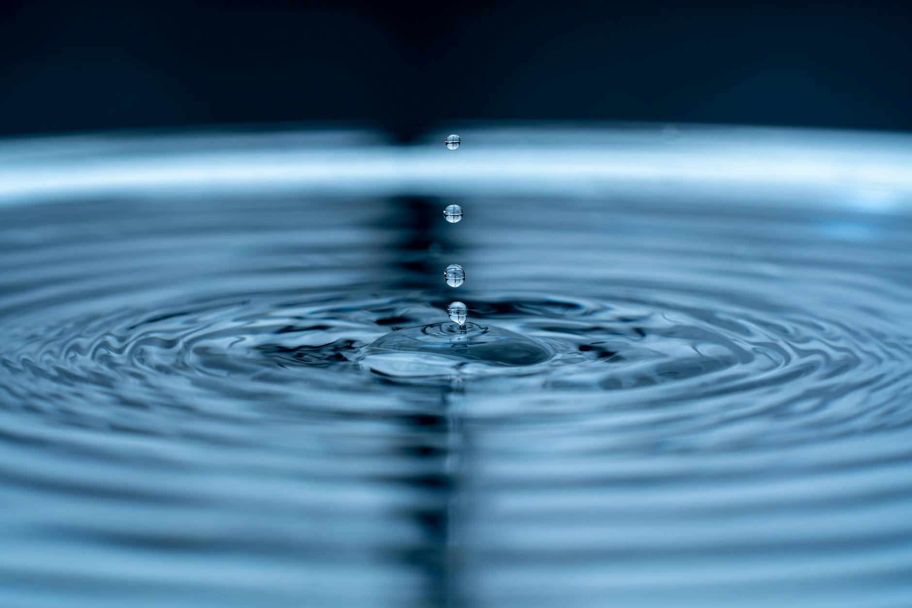 Single water droplet falling, representing water conservation in agriculture