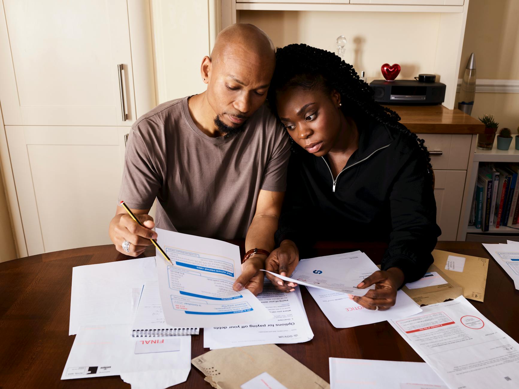 Family reviewing financial documents together planning for education expenses and savings strategies