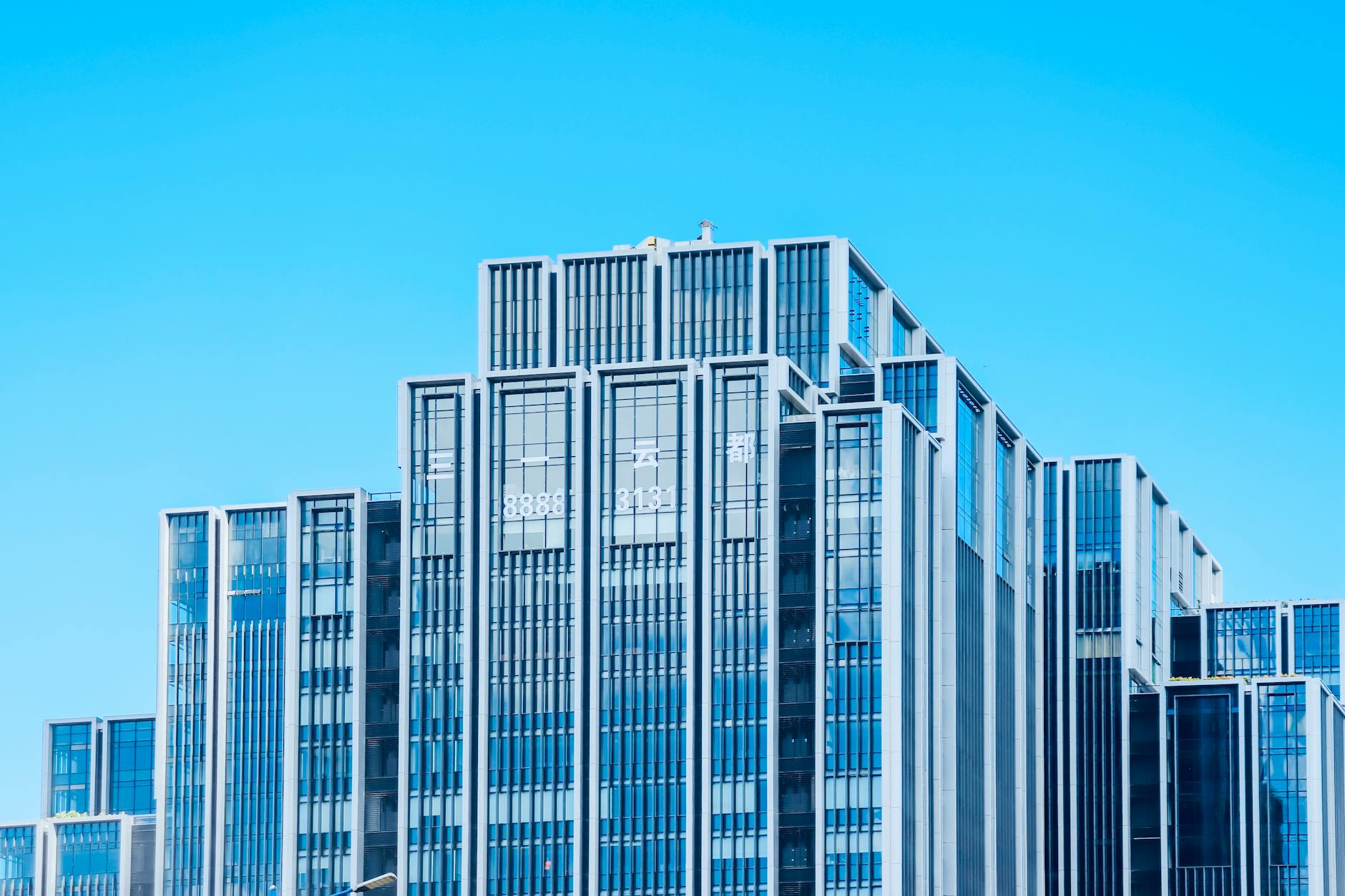 Exterior view of modern glass office building in business district