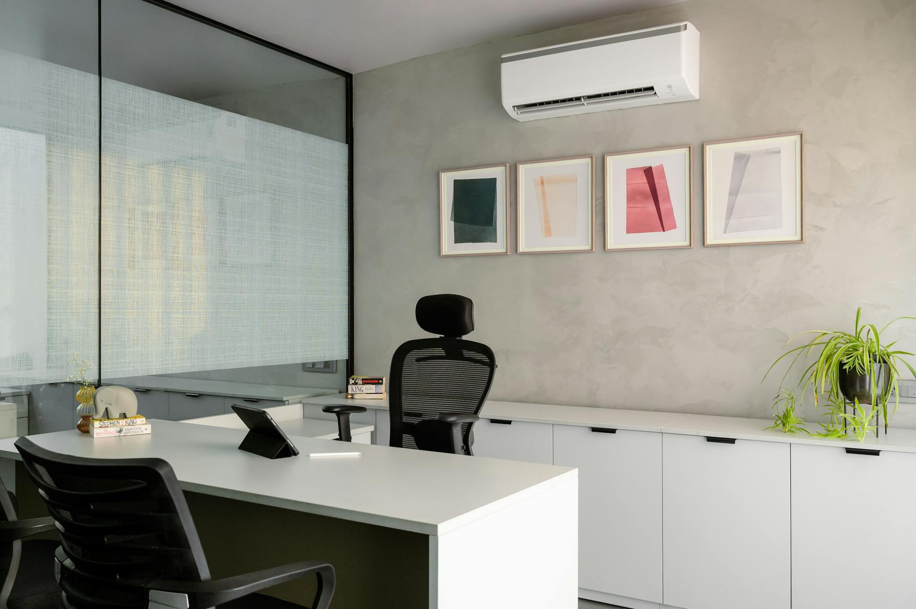 Modern corporate office workspace with employees collaborating on projects