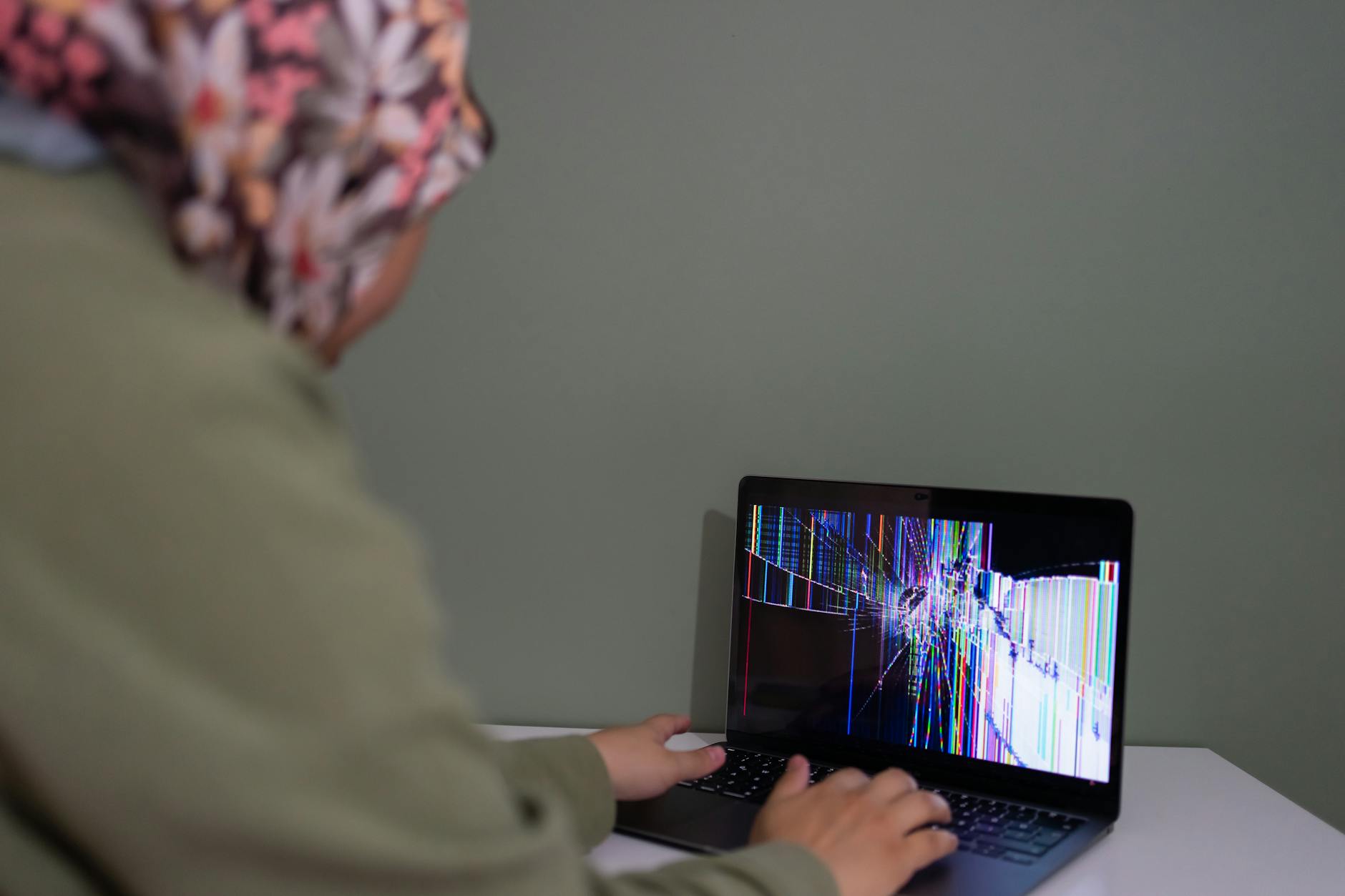 Laptop computer displaying streaming platform dashboard with content thumbnails