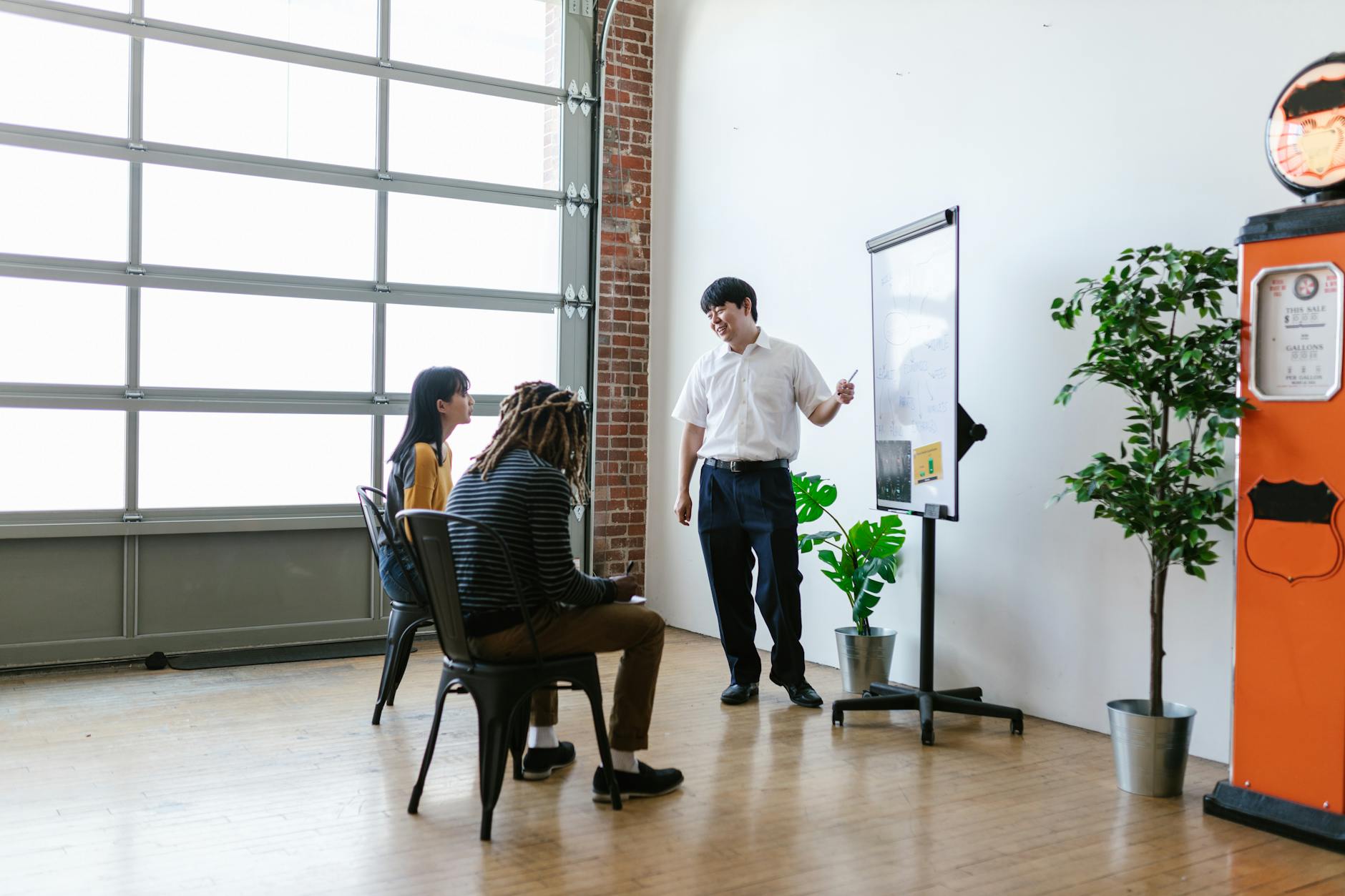 Corporate training session with instructor presenting to seated employees