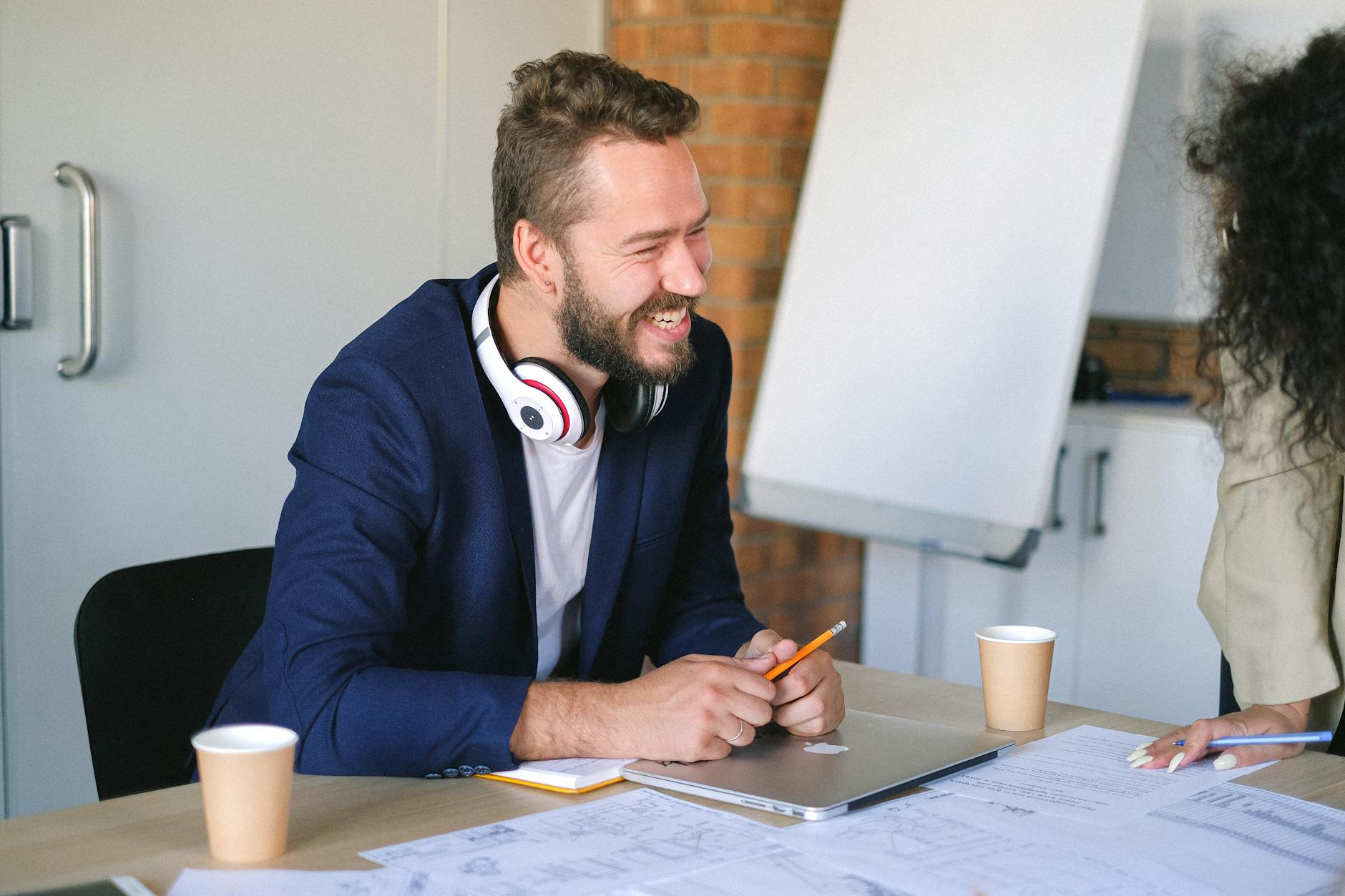 Diverse group of employees working collaboratively at modern workplace