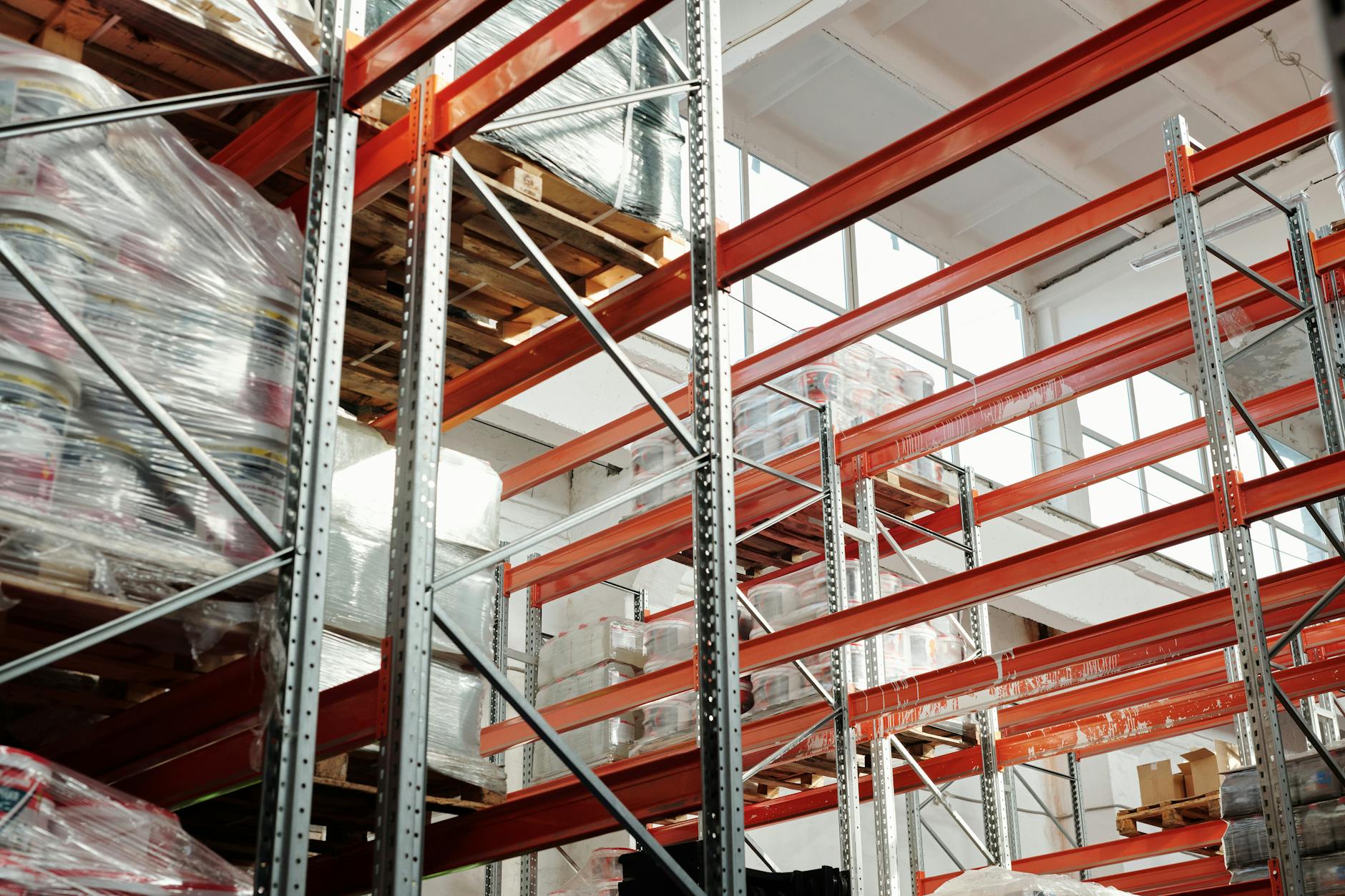 Large industrial warehouse space with high ceilings and concrete floors