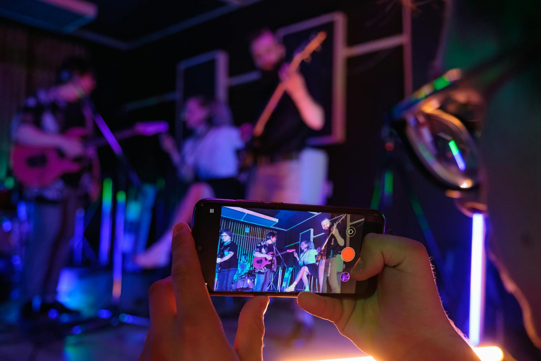 Smartphone displaying music streaming app interface with playlist