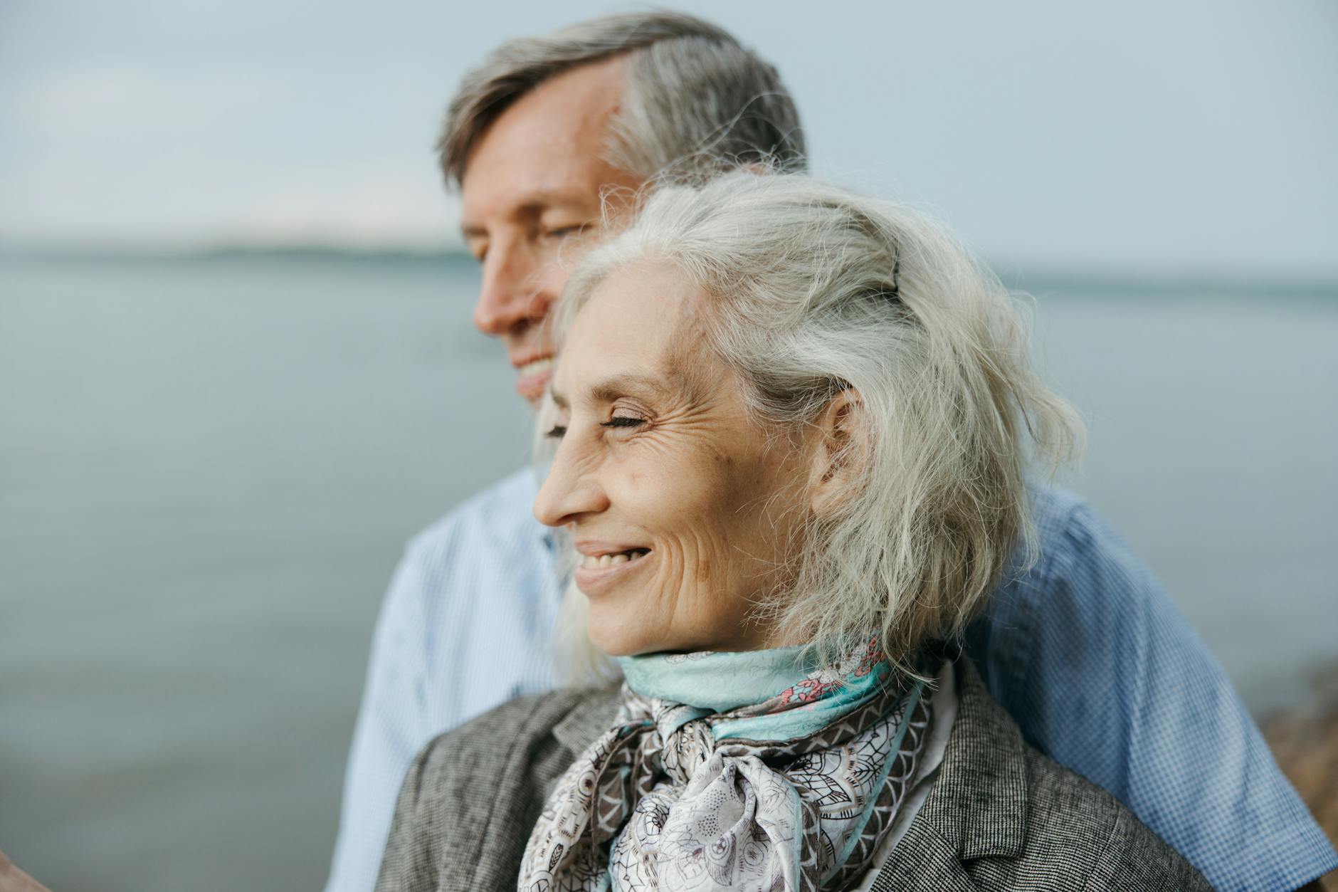 Senior couple reviewing financial documents and planning retirement strategies