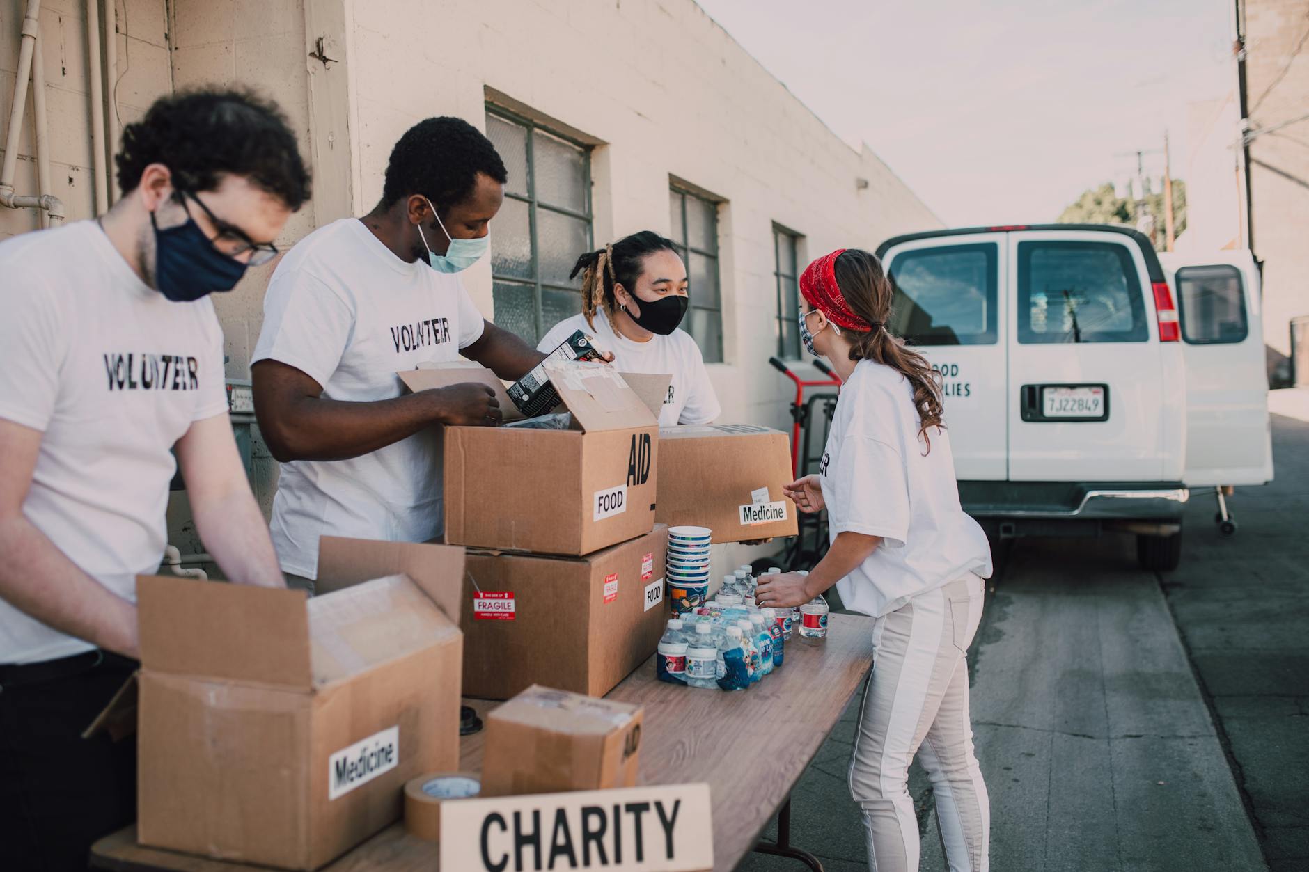 Group of people engaged in community service activities outdoors