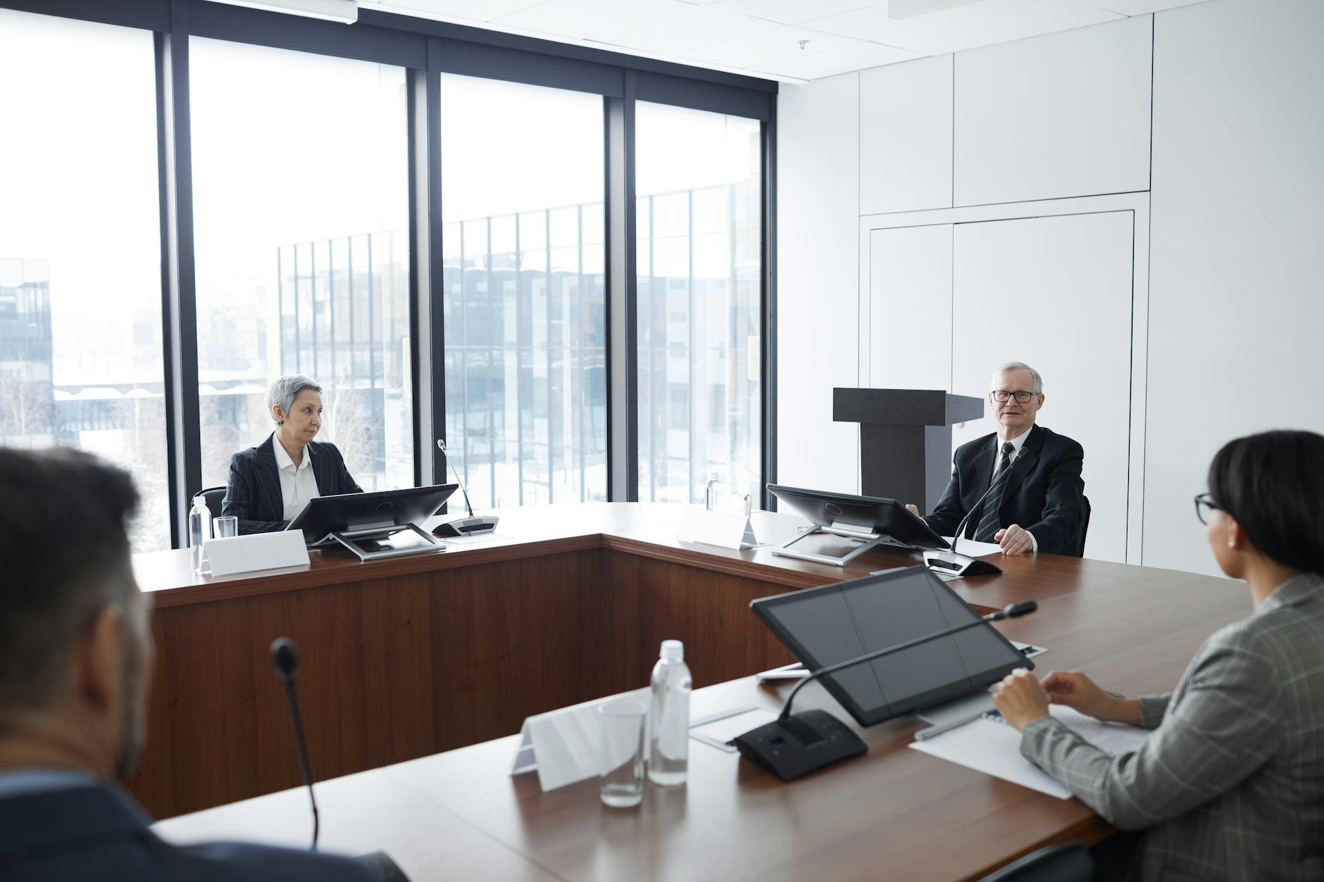 Business professionals discussing wellness program implementation in conference room