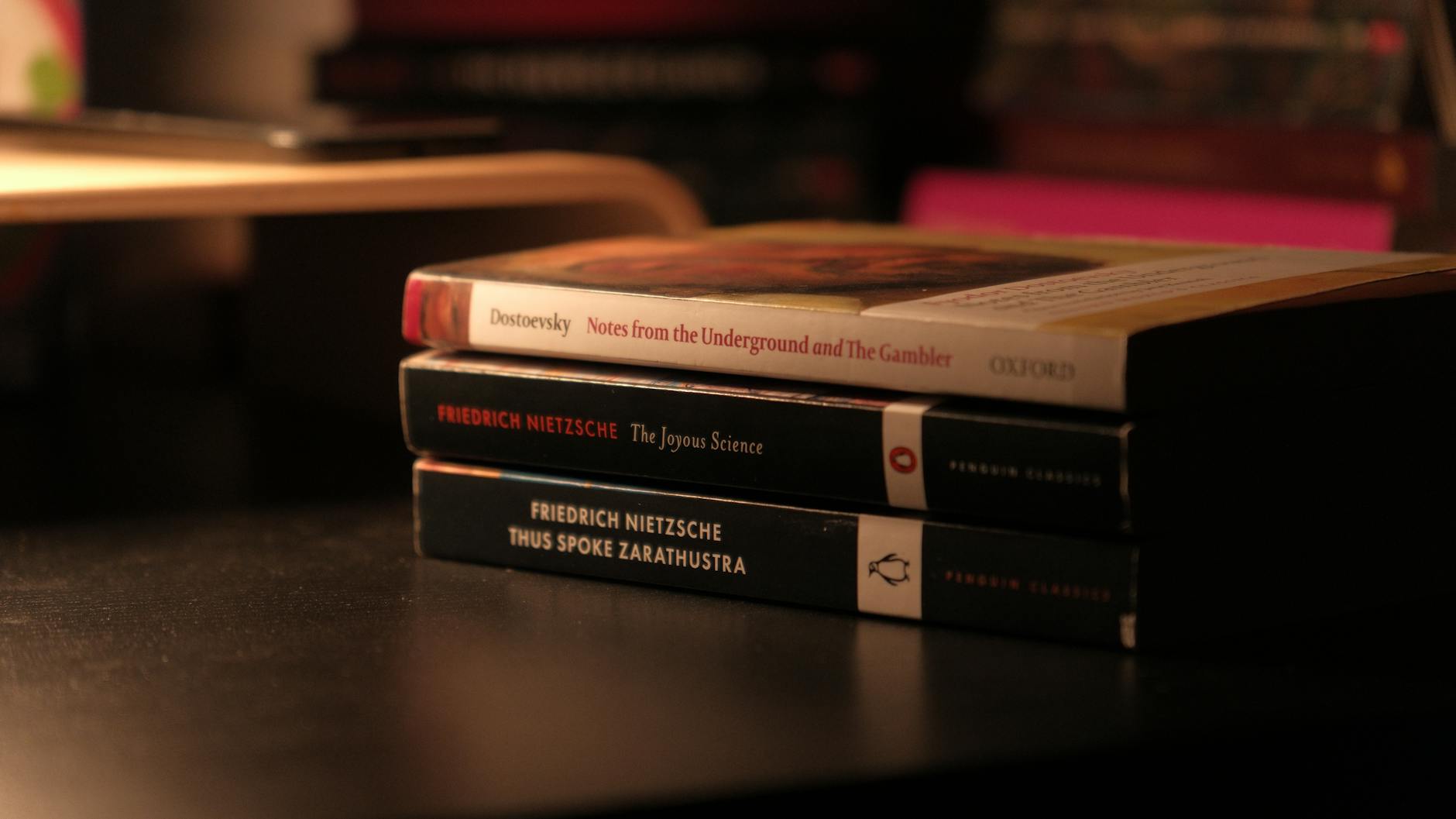 Stack of books on wooden surface representing book sales and literary events