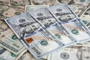 Large stacks of cash representing a record financial reserve held by an investor
