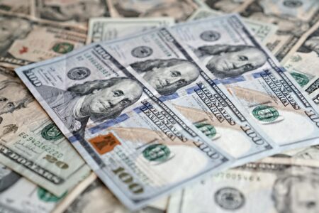 Large stacks of cash representing a record financial reserve held by an investor