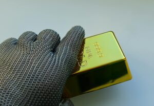 Stacked gold bars representing gold as a safe-haven asset for investors