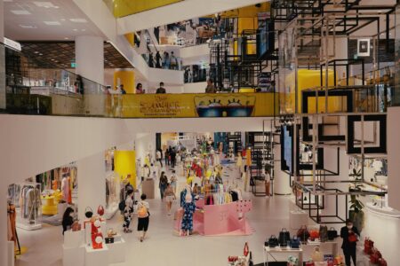 Interior of a mid-size retail store with merchandise displays and lighting