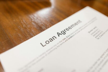 Closeup of financial loan documents on a desk representing private credit agreements