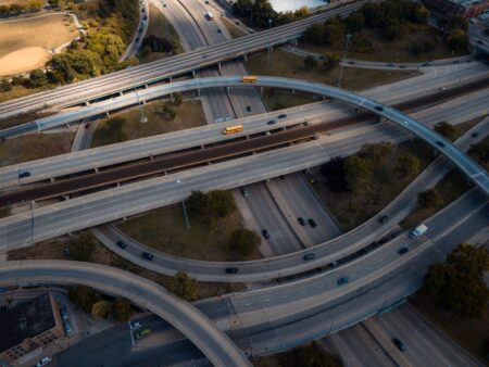 Aerial view of highway infrastructure and toll roads representing long-duration infrastructure assets