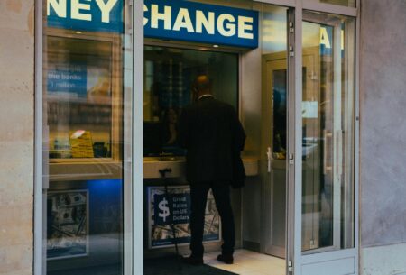 Currency exchange board showing multiple foreign currency rates fluctuating