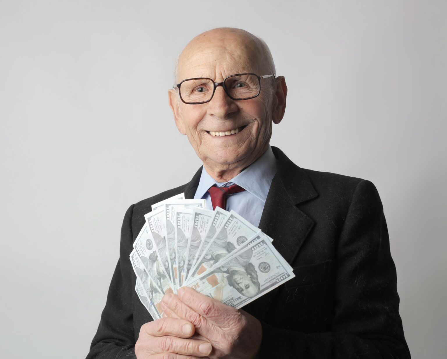Senior couple reviewing financial documents at a desk