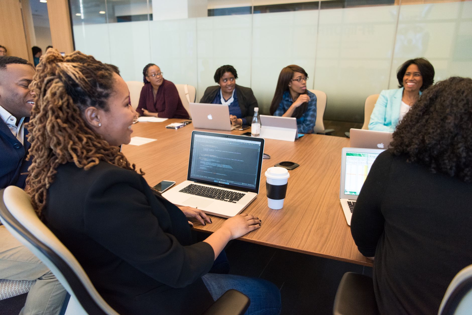 Corporate executives in a boardroom discussing strategy and financial decisions