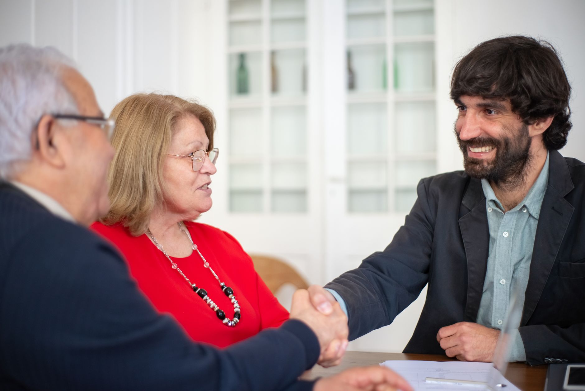 Financial advisor discussing investment options with a client at a meeting table