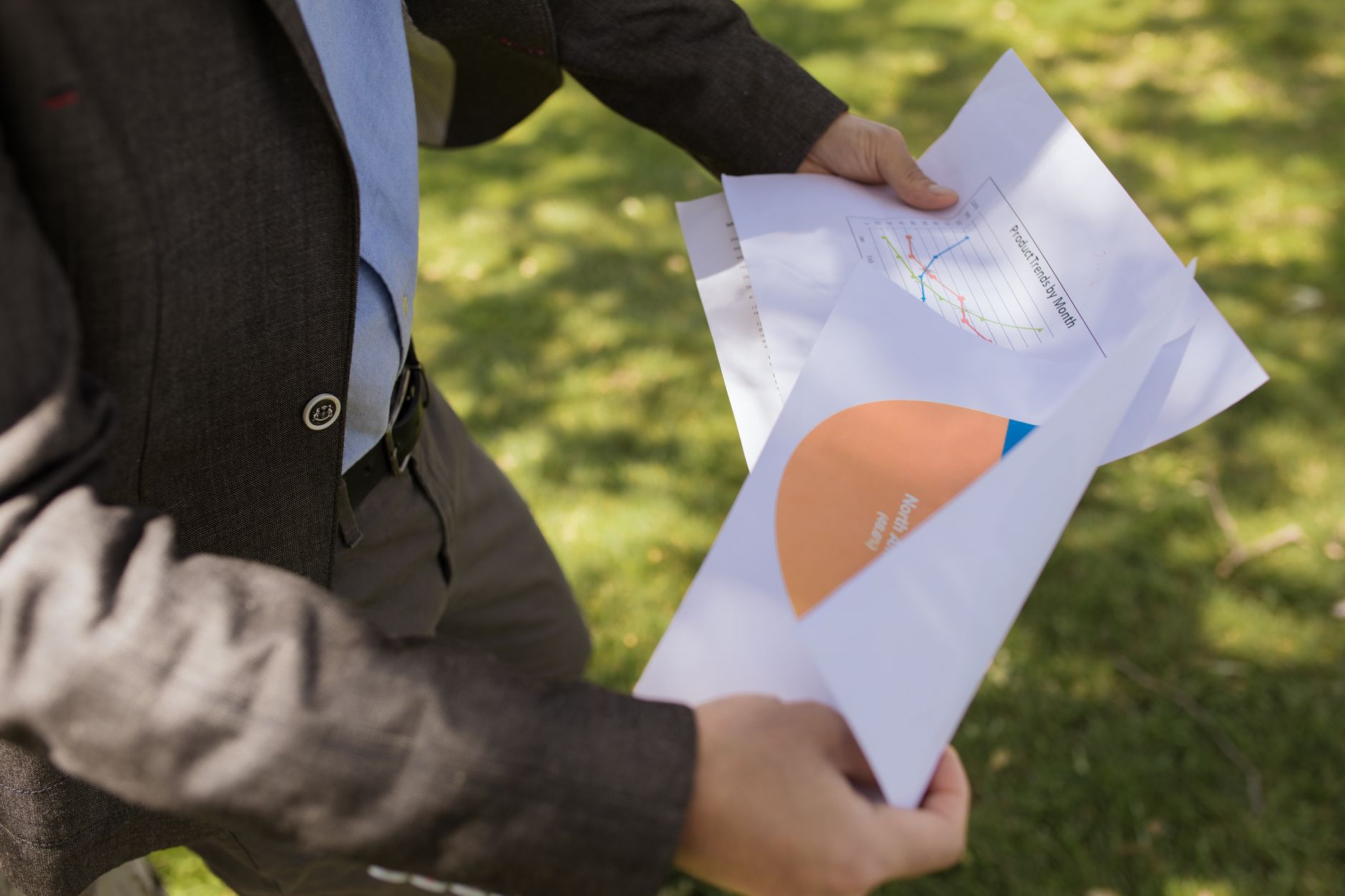 Investment portfolio documents and reports spread across a desk