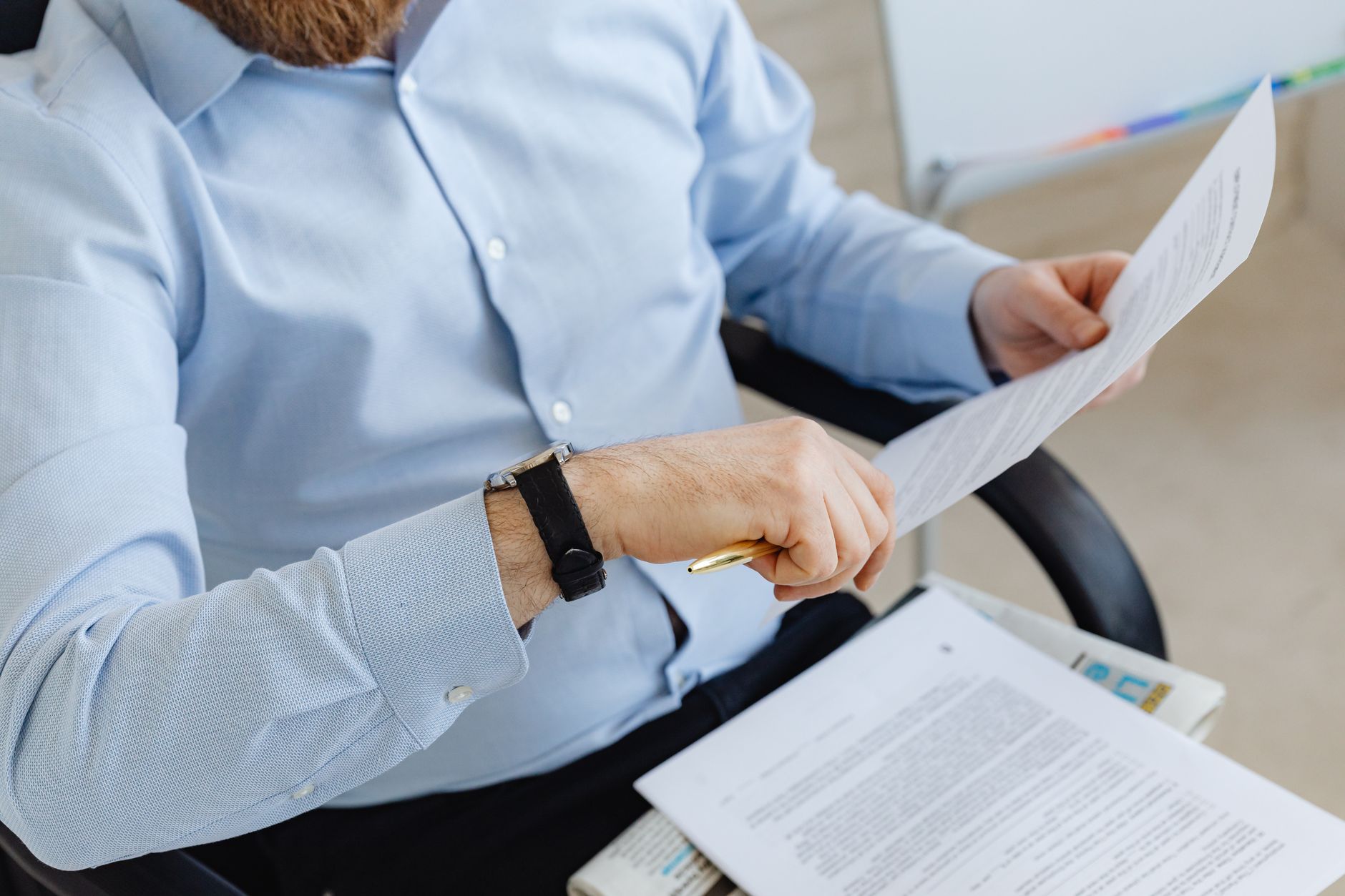 Investor reviewing financial documents and ETF performance reports at a desk