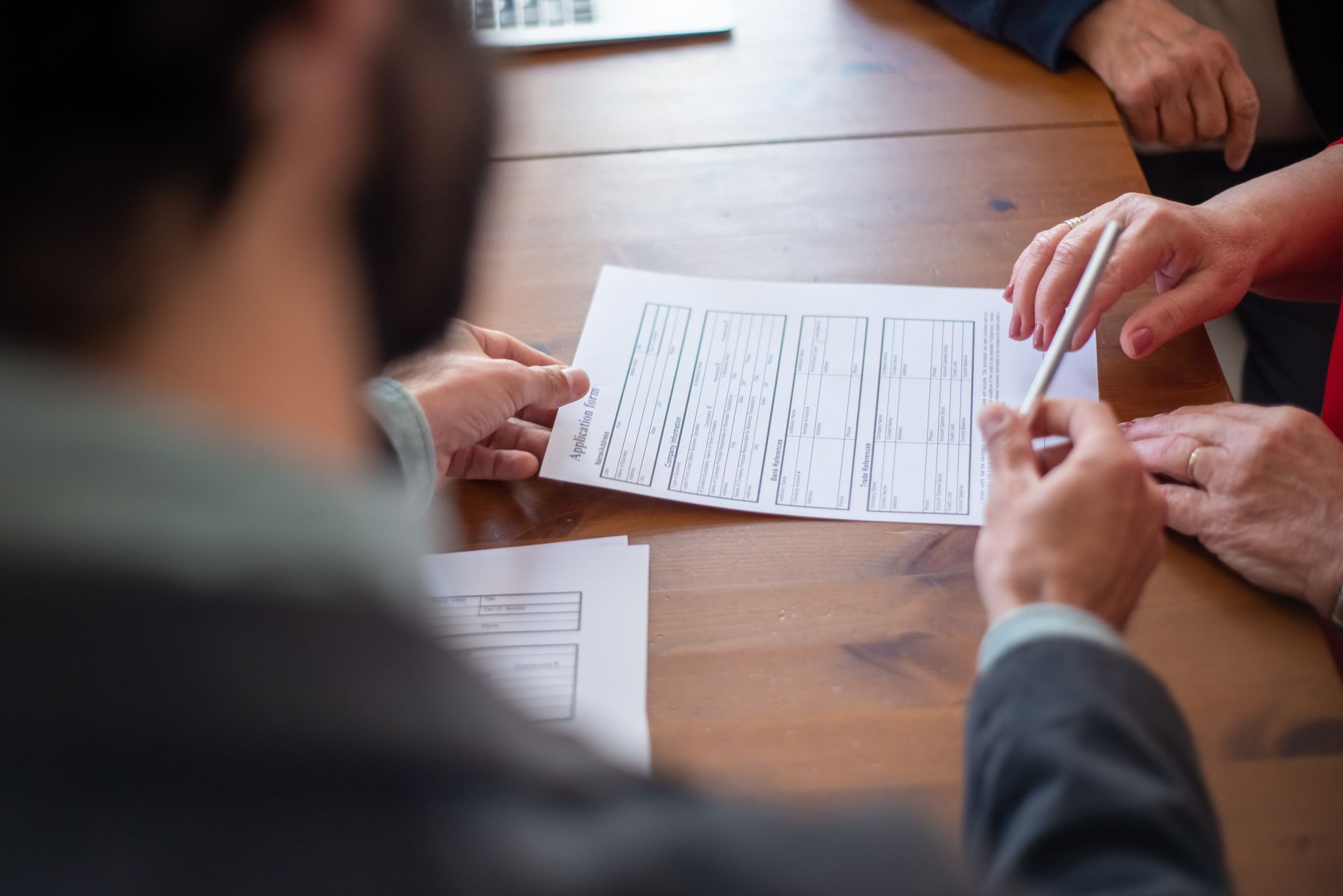Close-up of an insurance contract document on a desk, representing reinsurance agreements