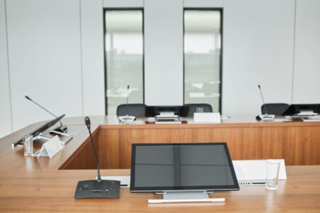 Corporate boardroom table representing conglomerate strategy meetings and restructuring decisions